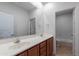 Bathroom with double sinks, spacious vanity, and a door leading to the toilet and bathtub at 30277 N 125Th Ln, Peoria, AZ 85383