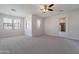 This bedroom features a door to the covered patio at 30277 N 125Th Ln, Peoria, AZ 85383