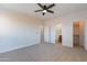 This bedroom features doors to the bathroom and closet at 30277 N 125Th Ln, Peoria, AZ 85383