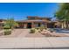 Charming two-story home with well-maintained desert landscaping and brick accents at 30277 N 125Th Ln, Peoria, AZ 85383