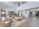 Bright living room featuring high ceilings, a modern staircase and neutral decor, creating an inviting atmosphere at 30277 N 125Th Ln, Peoria, AZ 85383