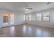 Bright living room features French doors to the backyard and ceramic tile floors at 30277 N 125Th Ln, Peoria, AZ 85383