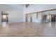 Spacious living room with tile flooring, high ceilings and staircase access to upper floors at 30277 N 125Th Ln, Peoria, AZ 85383