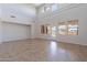 Sunlit living room with high ceilings, large windows and tile flooring throughout at 30277 N 125Th Ln, Peoria, AZ 85383