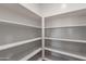 A walk-in pantry features shelving at 30277 N 125Th Ln, Peoria, AZ 85383