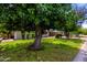 Traditional home exterior with mature trees and landscaping, offering shade and curb appeal at 3031 E Avalon Dr, Phoenix, AZ 85016