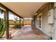Covered patio with concrete flooring, direct access to the backyard, and building utilities at 3031 E Avalon Dr, Phoenix, AZ 85016