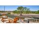 Charming balcony with outdoor seating and a built-in barbecue area at 31256 N 40Th Pl, Cave Creek, AZ 85331