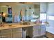 Bright bathroom with double sinks, a separate shower, and a tub at 31256 N 40Th Pl, Cave Creek, AZ 85331