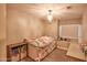 A cozy bedroom with soft lighting and plush carpet, creating a comfortable and inviting space at 31256 N 40Th Pl, Cave Creek, AZ 85331