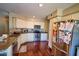 Well-lit kitchen with stainless steel appliances, white cabinets, and beautiful granite countertops at 31256 N 40Th Pl, Cave Creek, AZ 85331