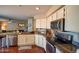 A well-lit kitchen with granite countertops, stainless steel appliances, and hardwood floors at 31256 N 40Th Pl, Cave Creek, AZ 85331