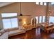 Open-concept living space with high ceilings, hardwood floors, many windows, and modern furniture at 31256 N 40Th Pl, Cave Creek, AZ 85331