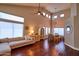 Open living and dining space featuring high ceilings, hardwood floors, and comfortable furniture at 31256 N 40Th Pl, Cave Creek, AZ 85331