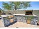 Well-equipped outdoor kitchen with built-in grill offers a perfect space for cooking and entertaining outdoors at 31256 N 40Th Pl, Cave Creek, AZ 85331