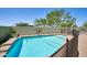 Sparkling pool with diving board, basketball hoop and stone deck offers a refreshing retreat in the backyard at 31256 N 40Th Pl, Cave Creek, AZ 85331