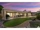 Beautiful backyard view with covered patio and lush landscaping at 3394 N 147Th Ln, Goodyear, AZ 85395