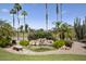 Backyard pond with mature landscaping and lush green lawn at 3394 N 147Th Ln, Goodyear, AZ 85395
