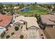 Aerial view of a single-story home featuring well-maintained landscaping, a large garage, and a view of the golf course at 3394 N 147Th Ln, Goodyear, AZ 85395