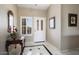 Warm foyer boasts tile flooring, decorative accents, and a window, creating an inviting entrance at 3394 N 147Th Ln, Goodyear, AZ 85395