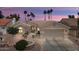 Charming single-story home featuring a desert-landscaped yard and attached two-car garage at 3394 N 147Th Ln, Goodyear, AZ 85395