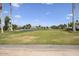 Expansive golf course view, lush green fairway and mature trees at 3394 N 147Th Ln, Goodyear, AZ 85395