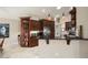 Well-appointed kitchen showcasing dark wood cabinetry, granite countertops, and a breakfast bar at 3394 N 147Th Ln, Goodyear, AZ 85395