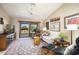 Bright living area featuring a vaulted ceiling, sliding glass doors to the patio, and an open layout at 3394 N 147Th Ln, Goodyear, AZ 85395