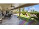 Covered patio with view of beautifully landscaped backyard at 3394 N 147Th Ln, Goodyear, AZ 85395