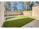 Backyard featuring artifical grass, a gravel border and privacy fence at 3440 E Southern Ave # 1107, Mesa, AZ 85204