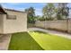 Backyard featuring artifical grass, a gravel border and privacy fence at 3440 E Southern Ave # 1107, Mesa, AZ 85204