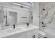 Bathroom featuring double sink vanity, white cabinets, a tub and decorative tile at 3440 E Southern Ave # 1107, Mesa, AZ 85204