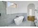 Bathroom featuring a soaking tub and walk in shower with neutral tile surround at 3440 E Southern Ave # 1107, Mesa, AZ 85204