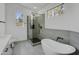 Modern bathroom featuring a soaking tub, and a glass enclosed shower at 3440 E Southern Ave # 1107, Mesa, AZ 85204