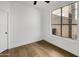 Bright bedroom with hardwood floors and a view of the neighborhood at 3440 E Southern Ave # 1107, Mesa, AZ 85204