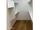 Walk-in closet featuring wood flooring, and shelving at 3440 E Southern Ave # 1107, Mesa, AZ 85204