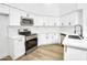 Modern kitchen with white cabinets, stainless steel appliances, and granite countertops at 3440 E Southern Ave # 1107, Mesa, AZ 85204