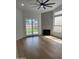 Bright living room with tile fireplace, backyard view, and patio access through sliding glass doors at 3440 E Southern Ave # 1107, Mesa, AZ 85204