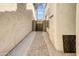 Outdoor walkway between houses and leading to private wooden gate at 3440 E Southern Ave # 1107, Mesa, AZ 85204