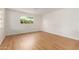 Bright bedroom features light-colored wood floors and natural light from the windows at 3526 E Cheery Lynn Rd, Phoenix, AZ 85018