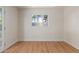 Bedroom with light hardwood floors, white walls, and plenty of natural light at 3526 E Cheery Lynn Rd, Phoenix, AZ 85018