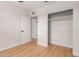 Bright bedroom features light-colored wood floors and a spacious closet for ample storage space at 3526 E Cheery Lynn Rd, Phoenix, AZ 85018