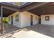 Carport area shows brick exterior with multiple entryways and ample concrete coverage at 3526 E Cheery Lynn Rd, Phoenix, AZ 85018
