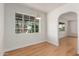 Bright dining room with new flooring, fresh white paint, and large windows at 3526 E Cheery Lynn Rd, Phoenix, AZ 85018