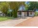Single-story home with white exterior, carport, and well-maintained front yard at 3526 E Cheery Lynn Rd, Phoenix, AZ 85018