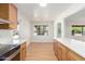 New kitchen with stainless steel appliances, stone countertops and open to dining area at 3526 E Cheery Lynn Rd, Phoenix, AZ 85018