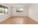 Bright living room featuring hardwood floors, fresh paint and large windows at 3526 E Cheery Lynn Rd, Phoenix, AZ 85018