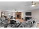 Spacious living room with cozy brick fireplace and ceiling fan at 3636 W Crocus Dr, Phoenix, AZ 85053