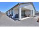 Exterior of home showing backyard with barbecue and outdoor furniture at 37903 W San Clemente St, Maricopa, AZ 85138