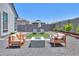 Serene backyard with a fire pit and outdoor seating at 37903 W San Clemente St, Maricopa, AZ 85138